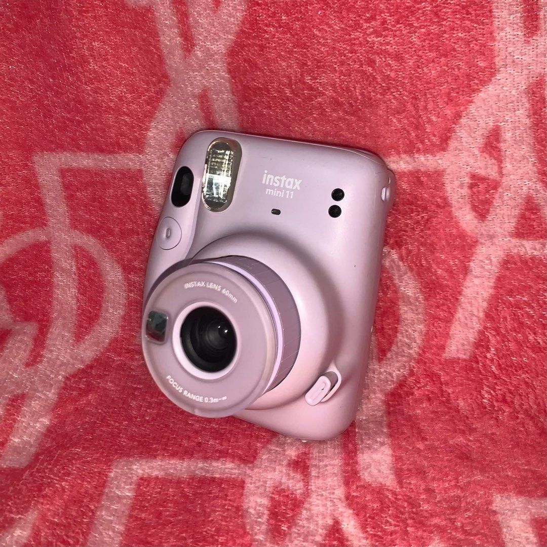 Fujifilm Instax Mini 11 (Category: Cameras) located in Alburquerque. Submitted by mysticwind-f323 (Listing ID 1471117414, Image 2). Description: 𐔌՞. .՞𐦯 Fujifilm Instax Mini 11 ⤷ ゛ ˎˊ˗ 2,500 + SF Condition: 9/10, preloved, 100% working ready to use! Color: Lilac Features: - 60mm f/12.7 lens - Automatic exposure and flash - Programmed electronic shutter (1/2 to 1/250 sec) - Dedicated selfie mode (0.3m-0.5m focus) activated by pulling the lens. I