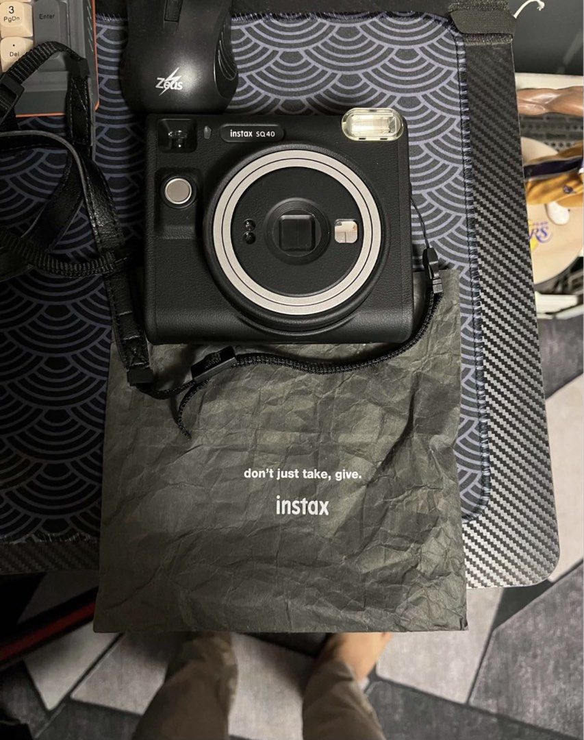 Fujifilm Instax Square SQ40 Camera (Category: Cameras) located in Dumaguete. Submitted by sellie06 (Listing ID 1471054979, Image 1). Description: ✅ Condition: Very Good / Mint Condition ✅ Complete with box, manuals, and strap ✅ Fully functional, no issues 💰 Original Price: ₱9,000 🔥 Selling Price: ₱7,500 only 📌 Film not included 📌 No extra batteries included.