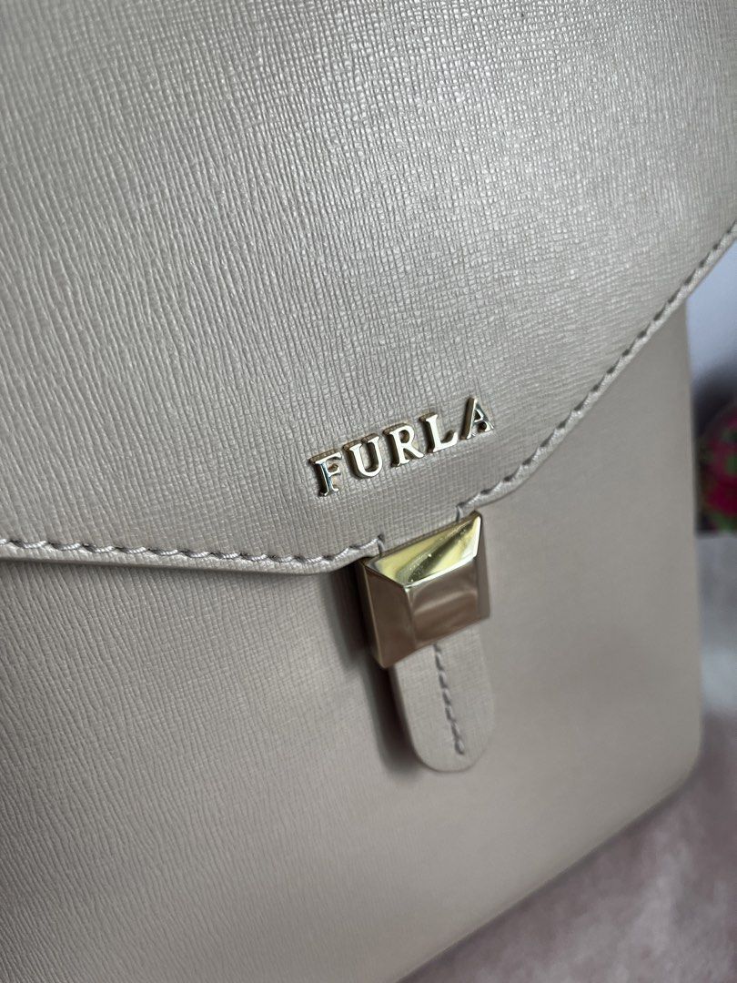 Furla Leather Backpack in Pink Beige (Category: Backpacks) located in Makati City. Submitted by shoplin (Listing ID 1470969579, Image 3). Description: - Brand: Furla - Material: Genuine leather - Color: Soft pink beige with gold-tone hardware - Rank A Original Furla Backpack Bag Bought in Japan Clean Inside & Out Semi Medium Size Location: On hand Makati Lalamove ready / J&T Gcash payment first basis only. Legit seller. .