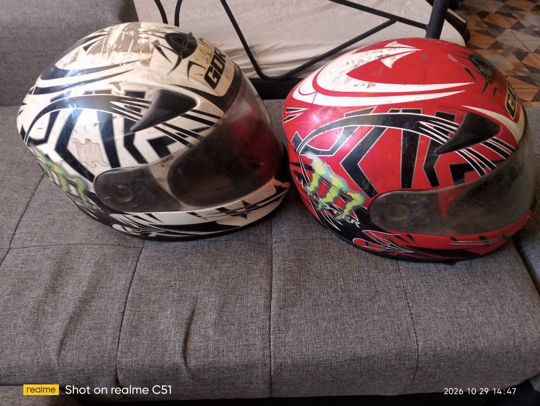 GDR Full Face Motorcycle Helmets 2nd hand (negotiable ) (Category: Bicycles) located in Manila. Submitted by sunfl0w3r_50 (Listing ID 1471011610, Image 2). Description: - Brand: GDR - Type: Full face motorcycle helmets (Set of 2 available) - Design 1: White and black graphic - Design 2: Red and black with Monster Energy decals - Features: Tinted visors, chin vents, and DOT certification stickers - Condition Notes: Interior padding has wear and pe