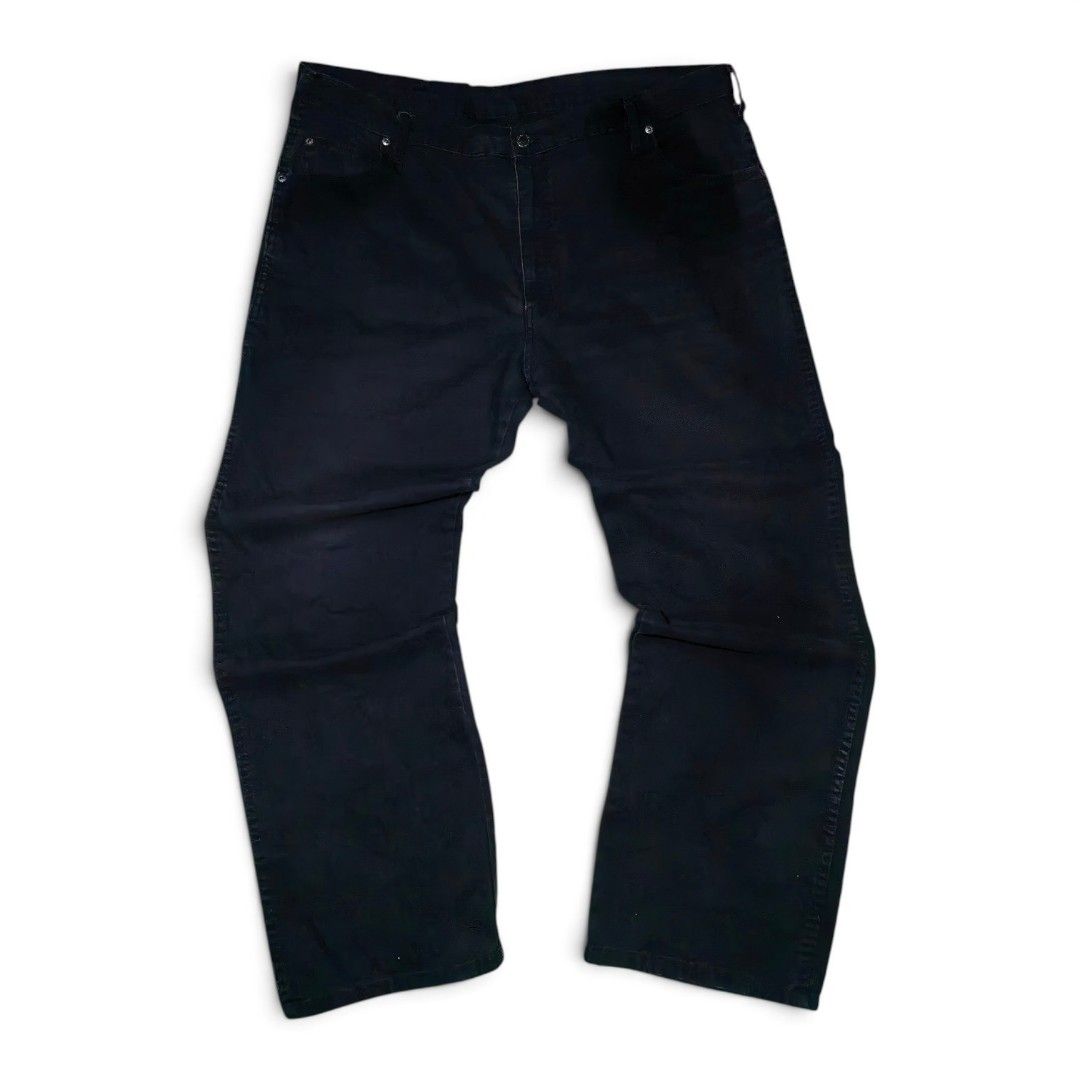 Genuine Dickies Black Work Pants Carpenter Jeans (Category: Jeans) located in Mabitac. Submitted by kitothrifty (Listing ID 1471084555, Image 3). Description: - Brand: Genuine Dickies - Color: Black - Size W - 42-43 L - 42 T - 14 H - 10 - Style: Carpenter pants / Relaxed fit - Material: Heavy-duty durable canvas - Features: Multiple utility pockets, side hammer loop, branded metal button closure, and Dickies logo patch on the back pocket - Condit