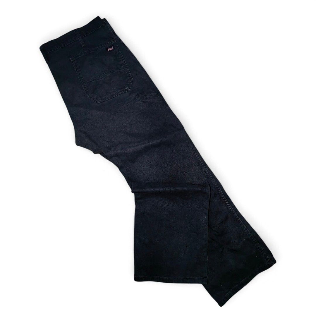 Genuine Dickies Black Work Pants Carpenter Jeans (Category: Jeans) located in Mabitac. Submitted by kitothrifty (Listing ID 1471084555, Image 1). Description: - Brand: Genuine Dickies - Color: Black - Size W - 42-43 L - 42 T - 14 H - 10 - Style: Carpenter pants / Relaxed fit - Material: Heavy-duty durable canvas - Features: Multiple utility pockets, side hammer loop, branded metal button closure, and Dickies logo patch on the back pocket - Condit