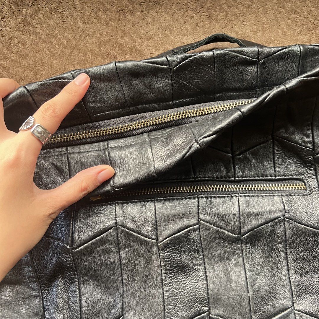 Genuine leather black slouchy dumpling fold-over bag (Category: Shoulder Bags) located in Makati City. Submitted by monu__ (Listing ID 1470977935, Image 2). Description: Perfect slouchy bag Super spacious Dumpling shaped bag when work over the shoulder Haa fold over flap with zipper for anti-theft High quality genuine leather NO issues. NO tearing or peeling of leather Still in good condition .