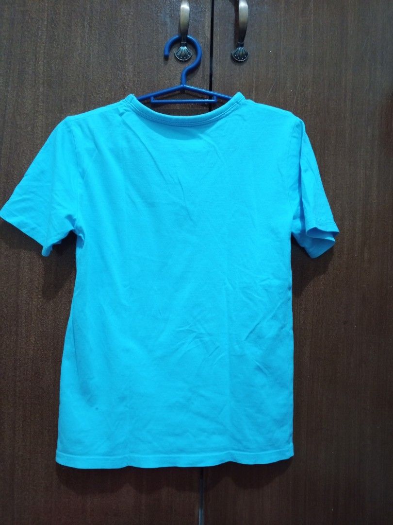 George T-Shirt for Kids (Category: Babies & Kids Fashion) located in Manila. Submitted by clariz76 (Listing ID 1471002609, Image 2). Description: Bright turquoise blue t-shirt featuring a large graphic print on the front with surf tournament text details. Crew neck design with short sleeves and a plain solid back. Vibrant colors and fun sporty design, great casual wear..