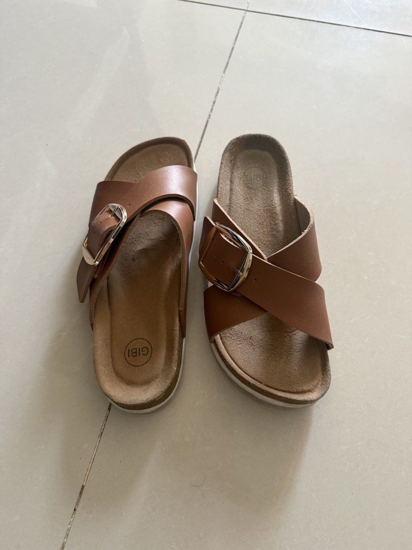 GIBI Cross Strap Sandals with Buckle (Category: Flats & Sandals) located in Cebu City. Submitted by mei041024 (Listing ID 1470932140, Image 1). Description: - Brand: Gibi -size: 36 - Color: Brown leather-look material - Design: Cross-strap slip-on with large gold-tone metal buckles .