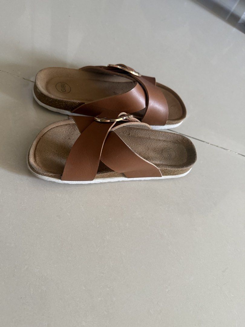 GIBI Cross Strap Sandals with Buckle (Category: Flats & Sandals) located in Cebu City. Submitted by mei041024 (Listing ID 1470932140, Image 2). Description: - Brand: Gibi -size: 36 - Color: Brown leather-look material - Design: Cross-strap slip-on with large gold-tone metal buckles .