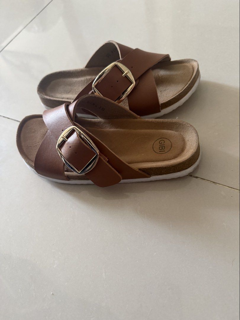 GIBI Cross Strap Sandals with Buckle (Category: Flats & Sandals) located in Cebu City. Submitted by mei041024 (Listing ID 1470932140, Image 3). Description: - Brand: Gibi -size: 36 - Color: Brown leather-look material - Design: Cross-strap slip-on with large gold-tone metal buckles .