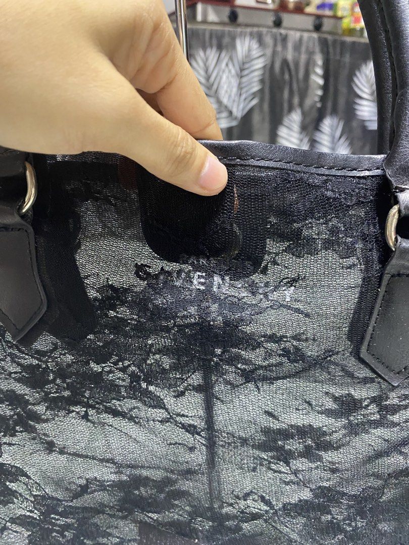 Givenchy Black Lace Tote Bag (Category: Tote Bags) located in Pasacao. Submitted by wengpullar37205 (Listing ID 1471063715, Image 2). Description: - Brand: Givenchy - Style: Tote bag / Everyday carryall - Material: Sheer lace fabric with floral pattern overlay and leather handles - Closure: Magnetic snap top closure - Interior: Very roomy, ideal for daily essentials - Condition: Good overall, with minor wear and cracking visible on the leather ha