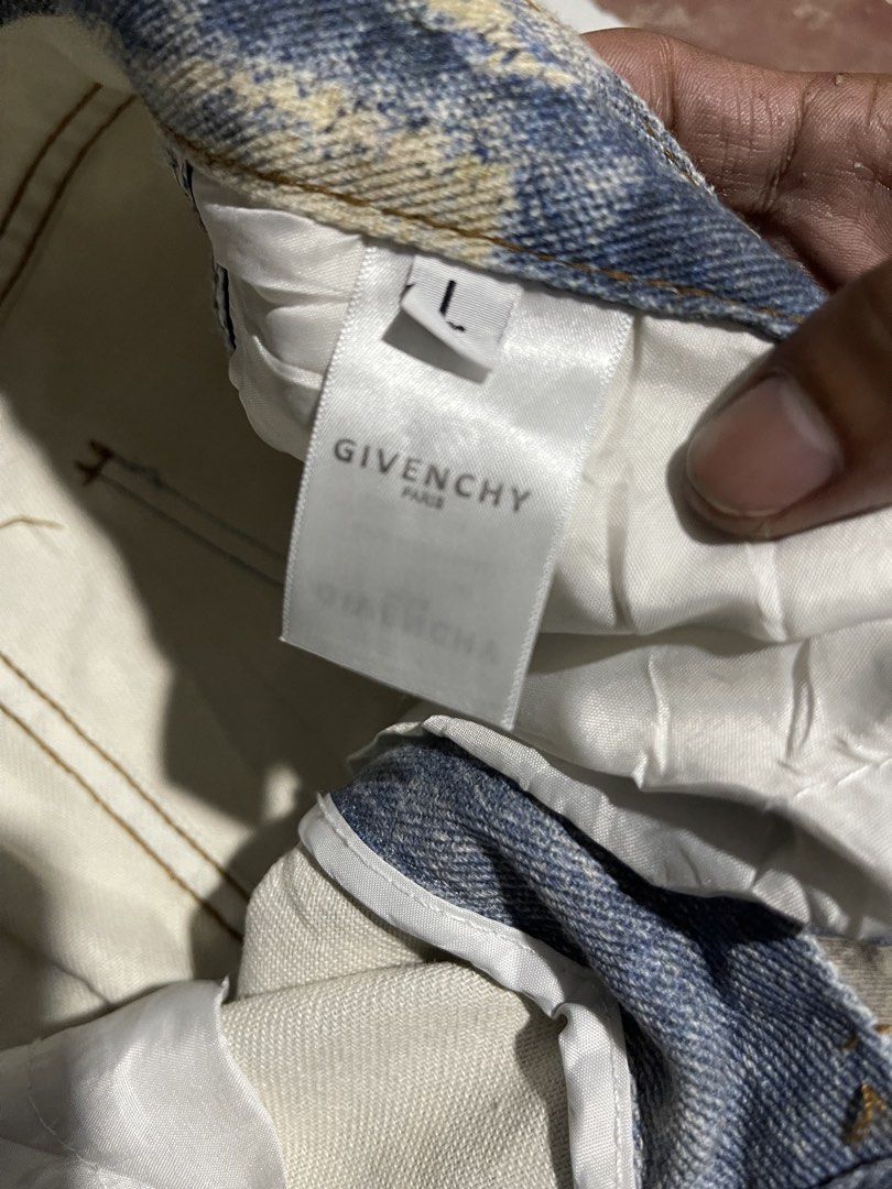 Givenchy Distressed Oversized Denim Jeans (Category: Jeans) located in Manila. Submitted by fastforest_65f95b (Listing ID 1471055193, Image 3). Description: Givenchy denim jeans in an oversized fit. Heavy distressing throughout with unique patchwork details on the front. Made in Portugal from 100% cotton. Size L tag attached. Includes standard inner brand labels and care tags..
