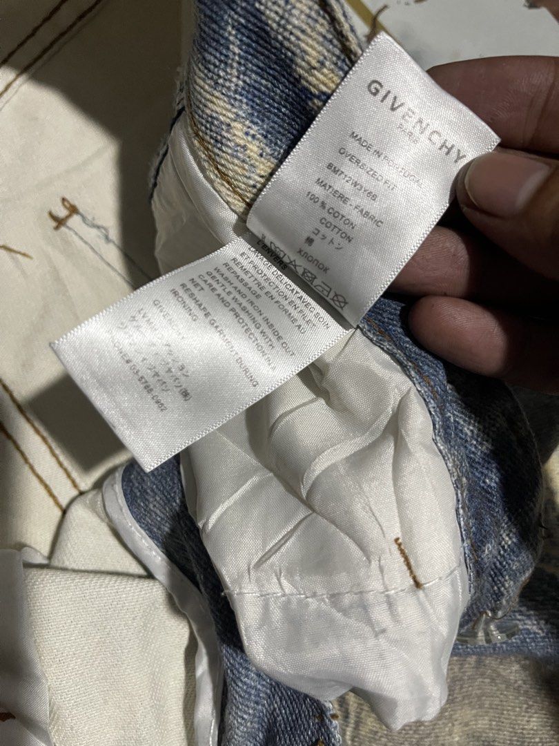 Givenchy Distressed Oversized Denim Jeans (Category: Jeans) located in Manila. Submitted by fastforest_65f95b (Listing ID 1471055193, Image 2). Description: Givenchy denim jeans in an oversized fit. Heavy distressing throughout with unique patchwork details on the front. Made in Portugal from 100% cotton. Size L tag attached. Includes standard inner brand labels and care tags..