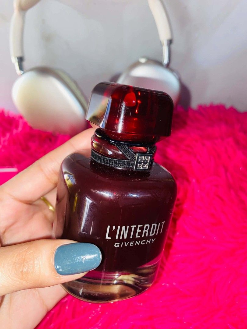 Givenchy L'Interdit Eau de Parfum Rouge (Category: Fragrance & Deodorants) located in Manila. Submitted by kriziealix123 (Listing ID 1471026816, Image 3). Description: - Authentic Givenchy L'Interdit Rouge Eau de Parfum - Full-size deep red bottle with matching cap, black ribbon, and silver logo charm - 99% full (only sprayed a couple of times) - Comes with original bright red box - Reason for selling: Decluttering/clearing out space.