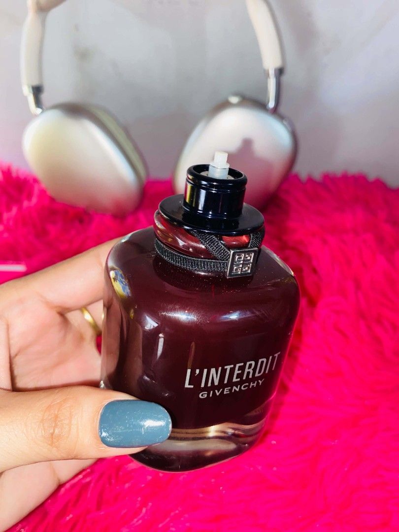 Givenchy L'Interdit Eau de Parfum Rouge (Category: Fragrance & Deodorants) located in Manila. Submitted by kriziealix123 (Listing ID 1471026816, Image 2). Description: - Authentic Givenchy L'Interdit Rouge Eau de Parfum - Full-size deep red bottle with matching cap, black ribbon, and silver logo charm - 99% full (only sprayed a couple of times) - Comes with original bright red box - Reason for selling: Decluttering/clearing out space.