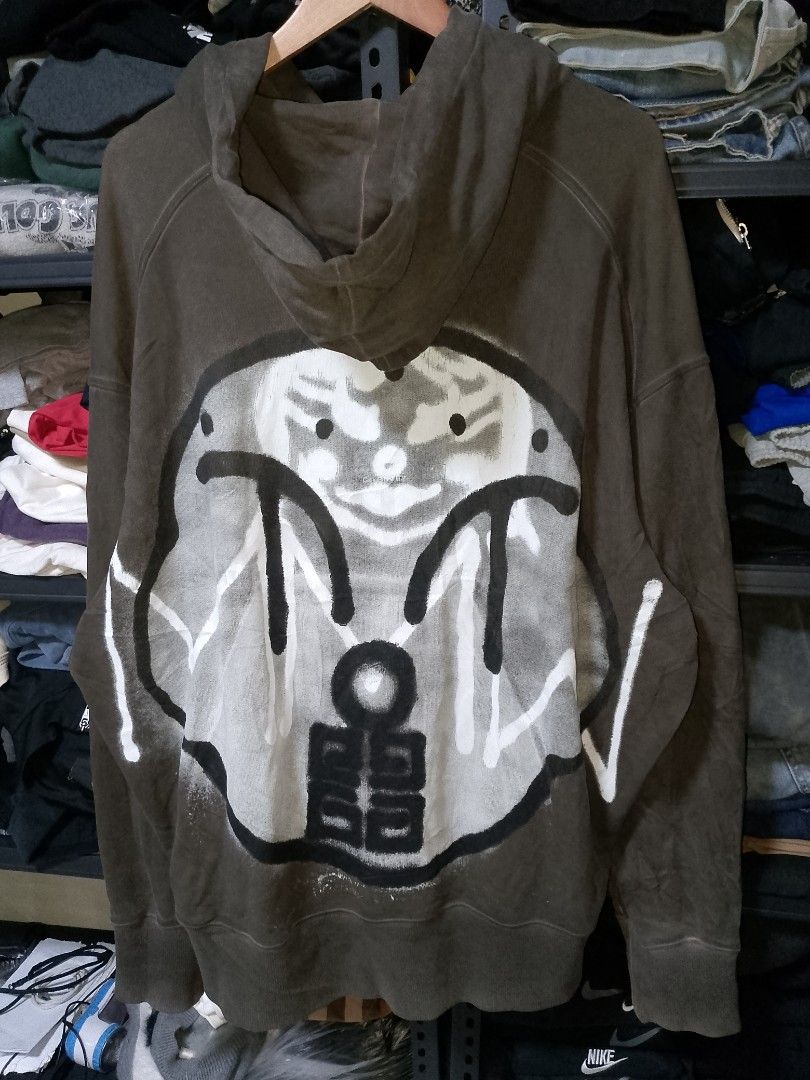 Givenchy Spray Paint Graphic Hoodie Brown (Category: Coats, Jackets and Outerwear) located in Manila. Submitted by mjthrifted_second (Listing ID 1471026289, Image 2). Description: - Authentic Givenchy hoodie in a versatile brown colorway with a vintage wash effect -Dimes: 31/32 - Features eye-catching spray-painted graphics on both the front and back - Crafted from premium, heavyweight cotton fabric for warmth and structure - Equipped with a cozy