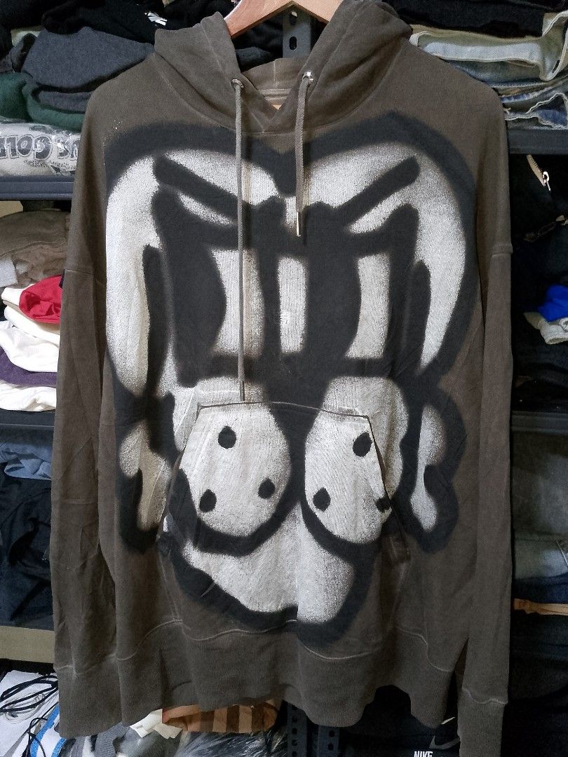Givenchy Spray Paint Graphic Hoodie Brown (Category: Coats, Jackets and Outerwear) located in Manila. Submitted by mjthrifted_second (Listing ID 1471026289, Image 1). Description: - Authentic Givenchy hoodie in a versatile brown colorway with a vintage wash effect -Dimes: 31/32 - Features eye-catching spray-painted graphics on both the front and back - Crafted from premium, heavyweight cotton fabric for warmth and structure - Equipped with a cozy