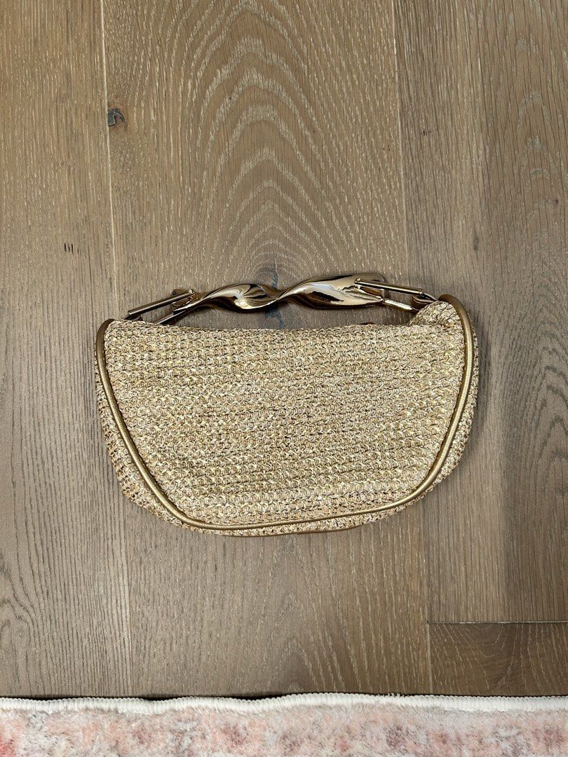 Gold bag with gold metal handle (Category: Clutches) located in Manila. Submitted by iloveclothesnmakeup444 (Listing ID 1470997746, Image 2). Description: Bought for 540 from shein No damages, never used Loc: Pasig MOD: Lalamove / J&T RFS: not my style.