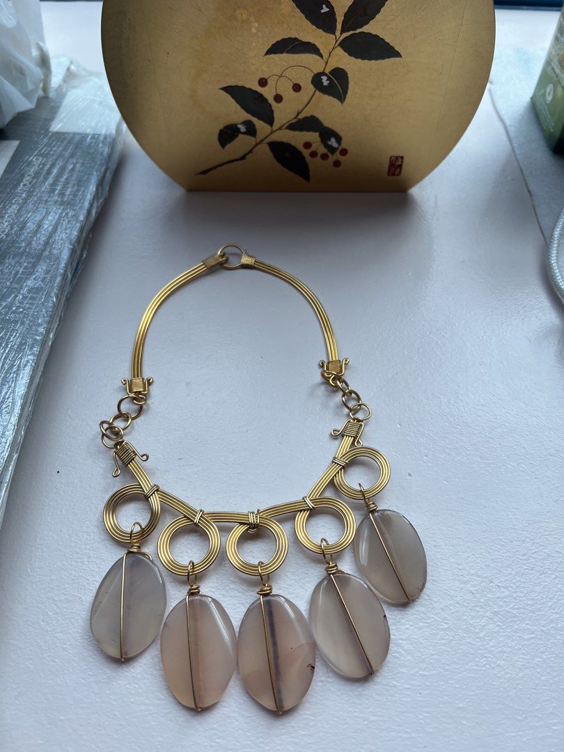 Gold wire wrapped statement necklace (Category: Necklaces) located in San Juan City. Submitted by iambernie (Listing ID 1470938440, Image 1). Description: Unused gift Statement piece to accessorize your plain outfits Gold wire necklace with light pink stones Just kept in storage .