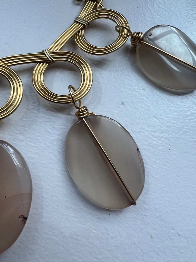 Gold wire wrapped statement necklace (Category: Necklaces) located in San Juan City. Submitted by iambernie (Listing ID 1470938440, Image 2). Description: Unused gift Statement piece to accessorize your plain outfits Gold wire necklace with light pink stones Just kept in storage .