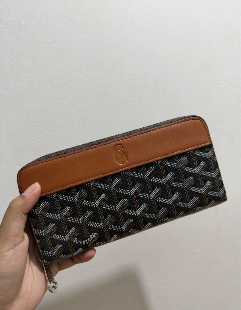 Goyard Zip Around Wallet Brown Monogram (Category: Luxury Bags & Wallets) located in Quezon City. Submitted by daniberido (Listing ID 1470998798, Image 1). Description: - Brand: Goyard long wallet - Design: Classic brown chevron pattern with smooth tan leather top panel - Details: Debossed monogram logo and clean stitching throughout - Closure: Secure zip-around with metal zipper pull - Interior: Spacious compartments for cards, cash, and coins -