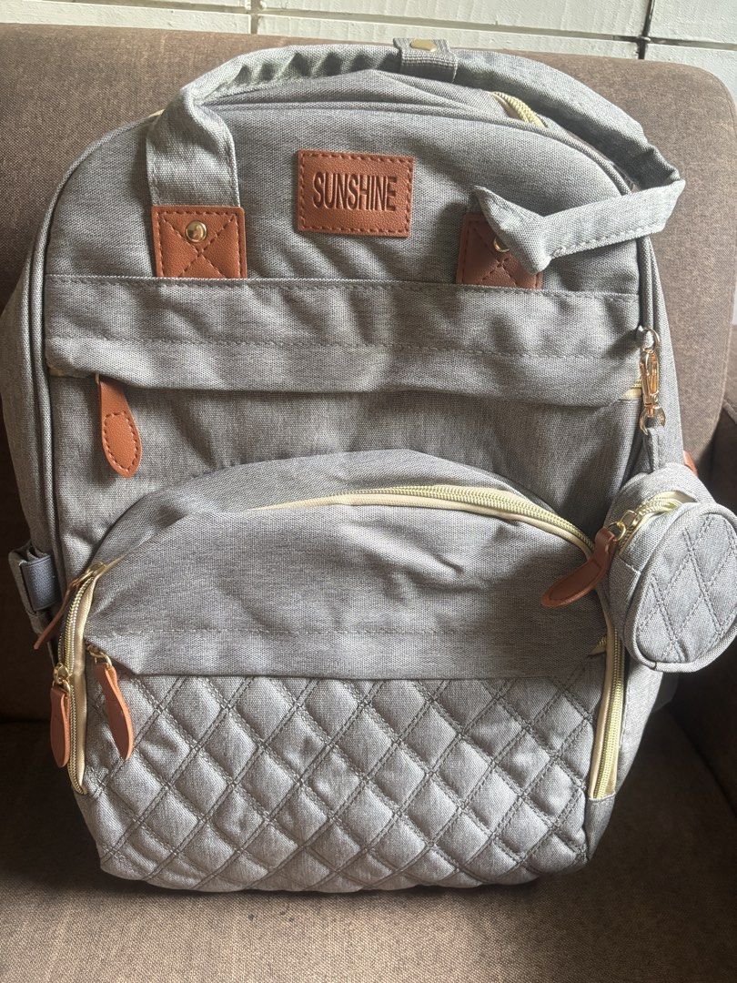 Gray Multifunctional Diaper Bag Backpack with Crib (Category: Diaper Bags & Wetbags) located in Quezon City. Submitted by shop.hannderella (Listing ID 1471038984, Image 2). Description: - Brand: Gray Sunshine - 2-in-1 Design: Converts from a stylish diaper backpack into a portable baby bed with a mesh canopy - Storage: Multiple internal compartments to organize all baby essentials - Pockets: Includes dedicated bottle pockets and a convenient smal