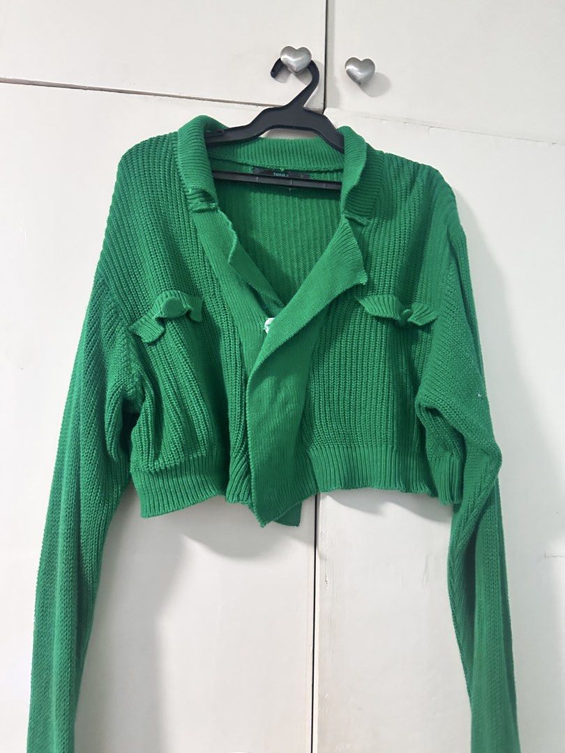 Green Knit Cropped Cardigan Sweater (Category: Coats, Jackets and Outerwear) located in Quezon City. Submitted by bentabelles (Listing ID 1471029489, Image 1). Description: - Color: Vibrant green - Style: Cropped knit cardigan with collar neckline - Details: Long sleeves, small chest pocket flaps with ruffled trim, chunky ribbed texture - Fit & Use: Great layering piece for cooler weather - Condition: Excellent / Brand new (Ready to ship!) - Mode