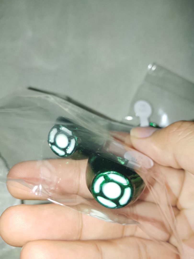Green Lantern Ring (Category: Rings) located in Manila. Submitted by barnesjame75271 (Listing ID 1471071407, Image 2). Description: - Product: Green Lantern Ring Price: 100 each - Available Sizes: Size 9 and Size 10 - Design: Iconic green lantern symbol with glossy metallic green finish - Feature: Glowing design effect visible in the dark - Condition: Brand new, packed individually with size tags - Ideal for: Cosplay, daily wear, or collection fo