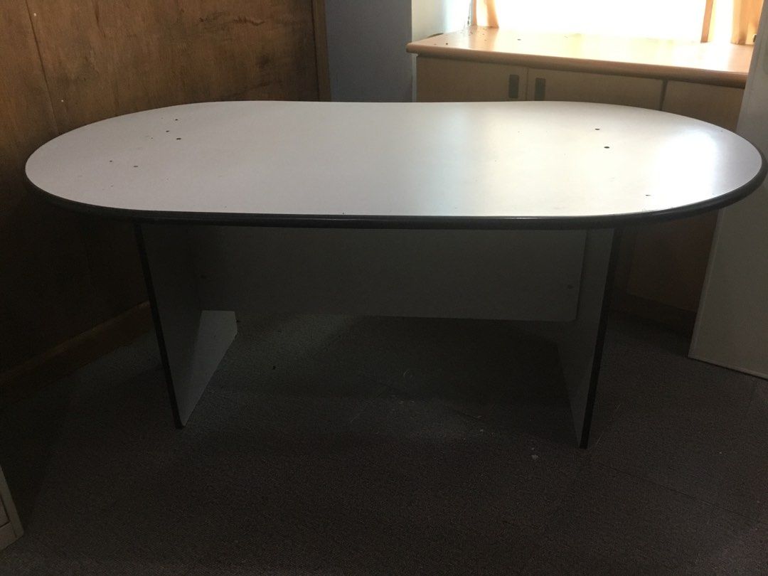 Grey Oval Meeting Table Office Conference Desk (Category: Tables & Sets) located in Manila. Submitted by roberto.enriquez (Listing ID 1470951165, Image 3). Description: - Colour: Grey - Shape: Oval - Material: Smooth laminate top with sturdy panel legs - Condition: Minor surface marks on top, solid construction - Ideal for: Team discussions, study sessions, and collaborative workspaces - Availability: Ready for pickup Length 71 Width 39 inches He