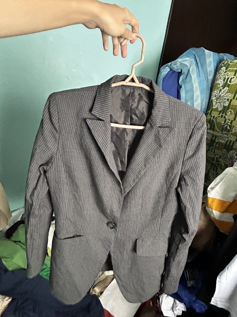 Grey Pinstripe Formal Blazer Suit Jacket (Category: Coats, Jackets and Outerwear) located in Manila. Submitted by lovely.453 (Listing ID 1470960359, Image 3). Description: - Style: Grey blazer with subtle white pinstripes size small to medium - Fit: Tailored fit with structured shoulders - Features: Single-button closure, two front pockets, and lined interior - Occasion: Ideal for office wear and formal events - Condition: Good overall condition,