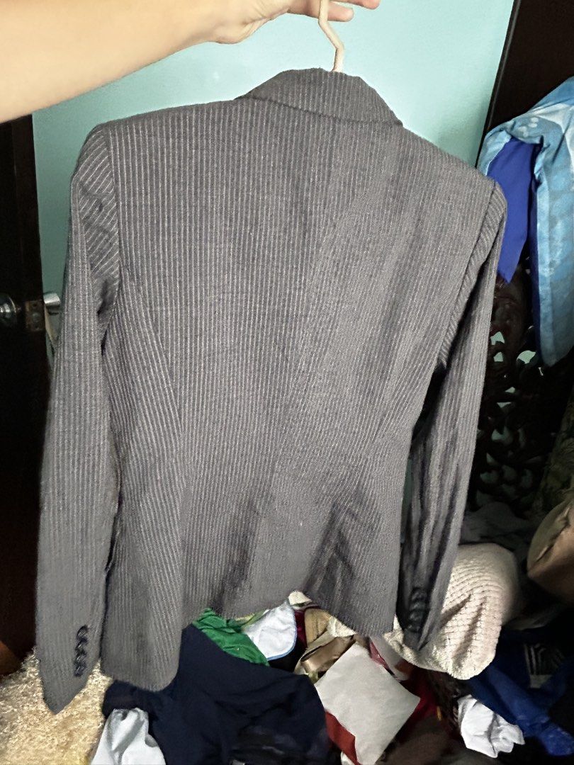 Grey Pinstripe Formal Blazer Suit Jacket (Category: Coats, Jackets and Outerwear) located in Manila. Submitted by lovely.453 (Listing ID 1470960359, Image 2). Description: - Style: Grey blazer with subtle white pinstripes size small to medium - Fit: Tailored fit with structured shoulders - Features: Single-button closure, two front pockets, and lined interior - Occasion: Ideal for office wear and formal events - Condition: Good overall condition,