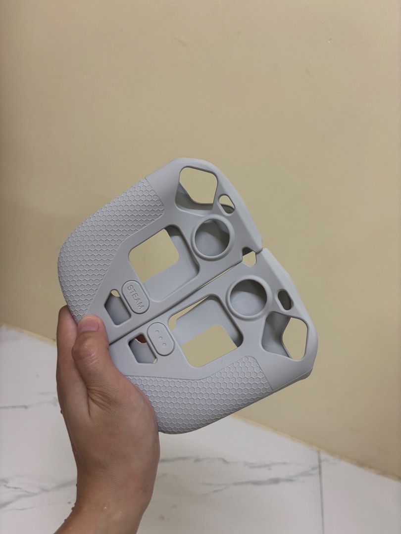 Grey Silicone Protective Case for Steam Deck with Box (Category: Cases & Covers) located in Manila. Submitted by vegajhasse57128 (Listing ID 1471038937, Image 2). Description: - Item: Grey silicone protective case for Steam Deck - Condition: Brand new, pristine condition, never used - Features: Textured honeycomb grip on sides, precise cutouts for all buttons and joysticks - Inclusions: Original box and inner packaging included - Reason to buy: P