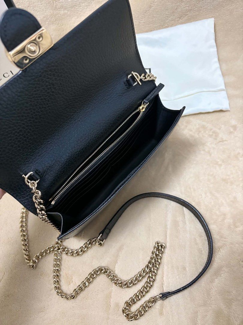 Gucci Black Leather Wallet on Chain Bag (Category: Luxury Bags & Wallets) located in Manila. Submitted by dianaalcar03441 (Listing ID 1471022848, Image 3). Description: - Authentic Gucci bag in black grained leather with luxurious gold-toned hardware - Features the iconic interlocking G closure for a classic look - Comfortable chain strap equipped with a leather shoulder guard - Well-organized interior complete with a zipped compartment and multi