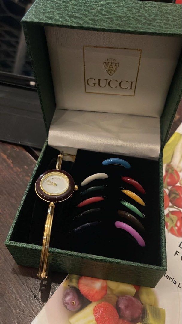 Gucci Change Bezel Bangle Watch with Interchangeable Bezels (Category: Women's Watches) located in Manila. Submitted by shemineforever (Listing ID 1471065126, Image 2). Description: - Authentic vintage Gucci bangle watch - Gold-tone hardware with classic white dial - Includes full set of interchangeable colored bezels (red, blue, green, yellow, and more) - Comes with original green presentation box - Keeps time accurately - New battery included -