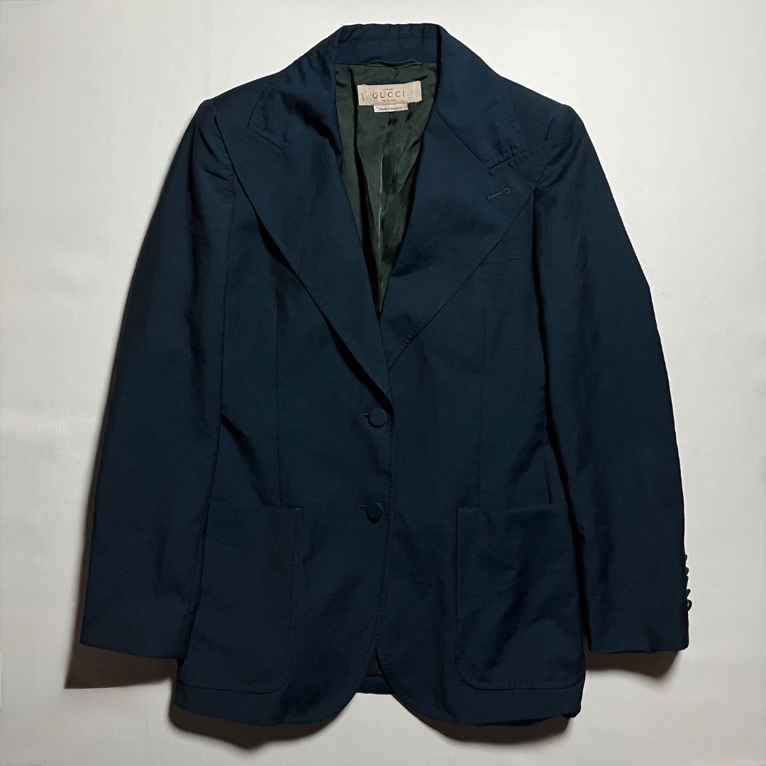 Gucci Emerald Green Blazer Coat (Category: Coats, Jackets and Outerwear) located in Caloocan City. Submitted by achilles_grails (Listing ID 1471040368, Image 1). Description: - Authentic Gucci Uniform blazer in dark blue - Made in Bulgaria with substantial, high-quality fabric weight - Two-button closure with structured lapels and button cuffs - Striking green interior lining - Rare collector's piece labeled "Uniform - Not for sale" - Excellent, 
