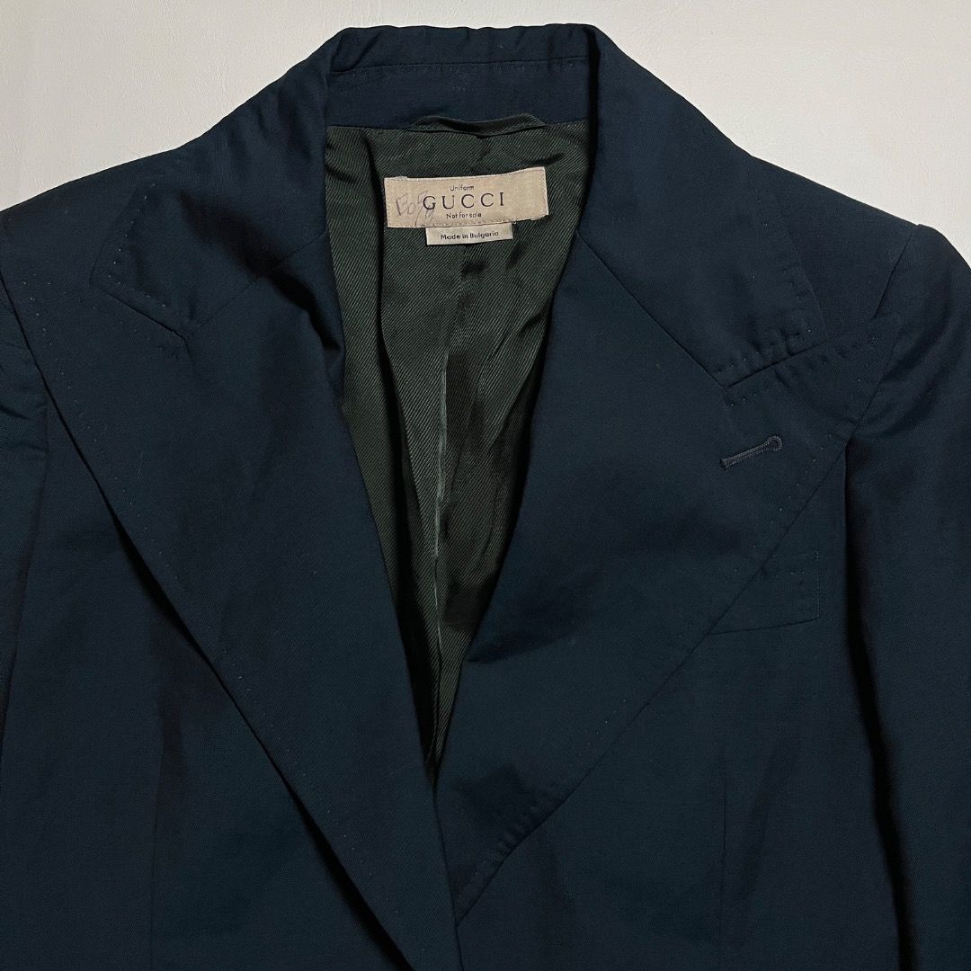 Gucci Emerald Green Blazer Coat (Category: Coats, Jackets and Outerwear) located in Caloocan City. Submitted by achilles_grails (Listing ID 1471040368, Image 2). Description: - Authentic Gucci Uniform blazer in dark blue - Made in Bulgaria with substantial, high-quality fabric weight - Two-button closure with structured lapels and button cuffs - Striking green interior lining - Rare collector's piece labeled "Uniform - Not for sale" - Excellent, 