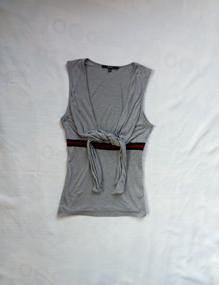Gucci front self tie knot sleeveless top (Category: Sleeveless) located in Bagabag. Submitted by thrift_stories96 (Listing ID 1471095986, Image 1). Description: Gucci front self tie knot sleeveless top Xsmall on tag fits small frame Length - 23 Width - 14.5 stretch up to 16 Condition - excellent No flaw.