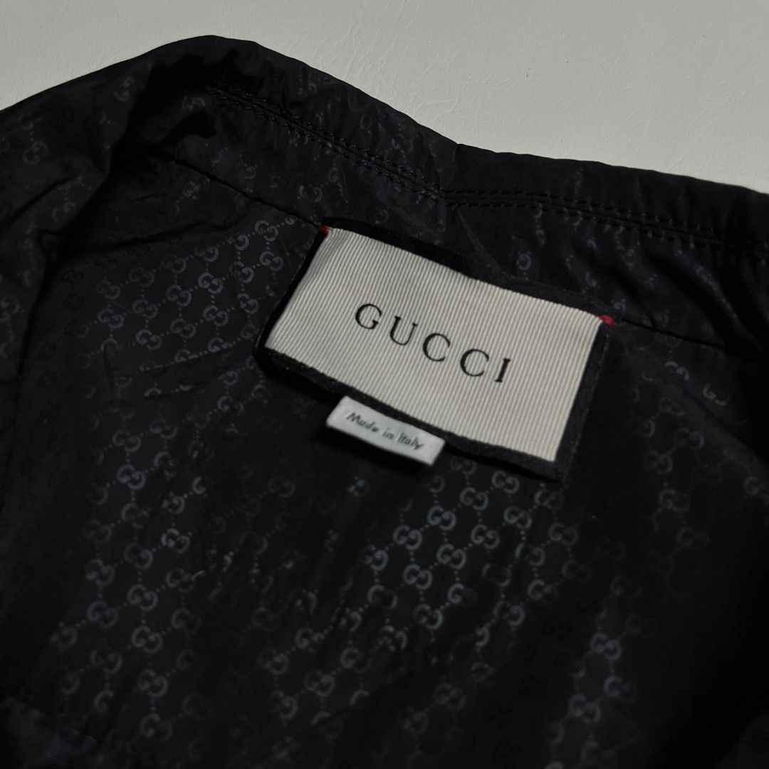 Gucci Monogram Black Blazer Jacket (Category: Coats, Jackets and Outerwear) located in Caloocan City. Submitted by achilles_grails (Listing ID 1471038974, Image 3). Description: - Brand: Gucci - Color: Black with all-over tonal GG monogram - Size: XS (Made in Italy) - Fit: Structured with notch lapels and two-button front closure - Detail: Signature red and green stripe on the chest pocket - Interior: Fully lined with matching GG monogram print -