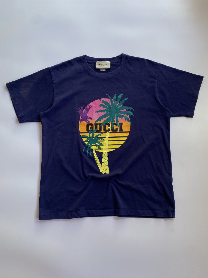Gucci palm tree logo (Category: Tshirts & Polo Shirts ) located in Kalibo. Submitted by kurt_ismael (Listing ID 1470995897, Image 1). Description: Gucci palm tree logo Actual color: dark violet Width: 23 Length: 28 Excellent condition Color rate: 9.8/10 Issue: minor discoloration on right shoulder only (kindly check last pic) Still in presentable condition .