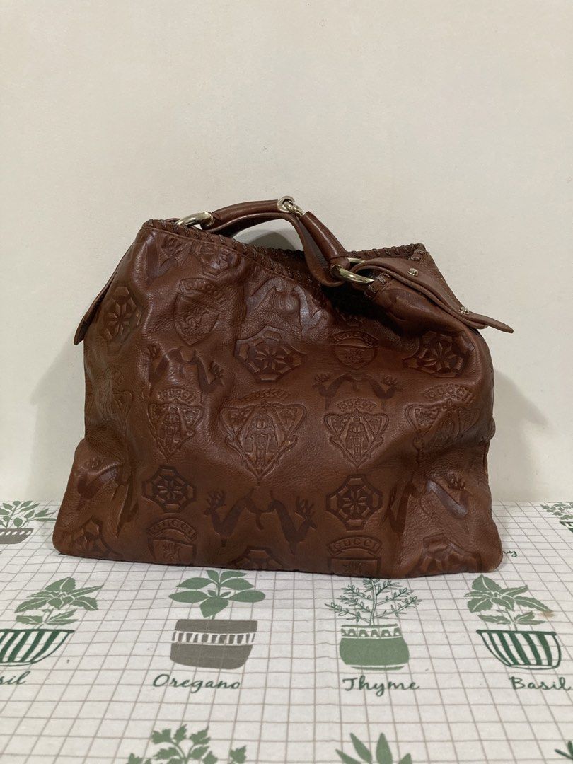 Gucci Pelham GUCCISSIMA HOBO BAG (Category: Luxury Bags & Wallets) located in Dapitan. Submitted by thrift_archive2026 (Listing ID 1471040790, Image 1). Description: 𝐆𝐮𝐜𝐜𝐢 𝐏𝐞𝐥𝐡𝐚𝐦 𝐆𝐮𝐜𝐜𝐢𝐬𝐬𝐢𝐦𝐚 𝐇𝐨𝐛𝐨 𝐁𝐚𝐠 𝐢𝐧 𝐫𝐢𝐜𝐡 𝐛𝐫𝐨𝐰𝐧 𝐞𝐦𝐛𝐨𝐬𝐬𝐞𝐝 𝐥𝐞𝐚𝐭𝐡𝐞𝐫 - Released during the Frida Giannini era (2000s–mid-2010s), this rare collector’s edition stands out for its detailed heraldic shields featuring the Gucci Crest (knig