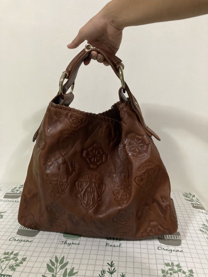 Gucci Pelham GUCCISSIMA HOBO BAG (Category: Luxury Bags & Wallets) located in Dapitan. Submitted by thrift_archive2026 (Listing ID 1471040790, Image 2). Description: 𝐆𝐮𝐜𝐜𝐢 𝐏𝐞𝐥𝐡𝐚𝐦 𝐆𝐮𝐜𝐜𝐢𝐬𝐬𝐢𝐦𝐚 𝐇𝐨𝐛𝐨 𝐁𝐚𝐠 𝐢𝐧 𝐫𝐢𝐜𝐡 𝐛𝐫𝐨𝐰𝐧 𝐞𝐦𝐛𝐨𝐬𝐬𝐞𝐝 𝐥𝐞𝐚𝐭𝐡𝐞𝐫 - Released during the Frida Giannini era (2000s–mid-2010s), this rare collector’s edition stands out for its detailed heraldic shields featuring the Gucci Crest (knig
