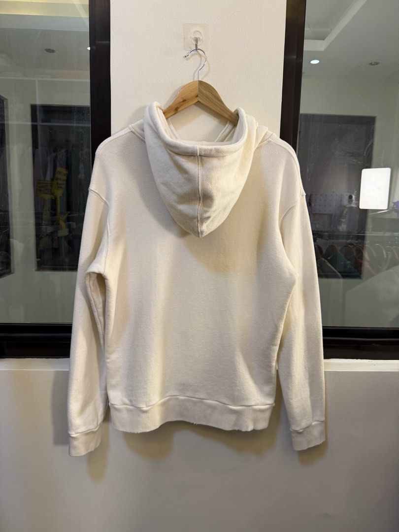 Gucci Pullover Hooded Sweatshirt (Category: Coats, Jackets and Outerwear) located in Paranaque City. Submitted by preluxeshop_ph (Listing ID 1471015198, Image 3). Description: Brand: Gucci •Style: Pullover Hooded Sweatshirt / Hoodie •Color: Off-White / Cream •Design Features: Front embroidered sequin cat face graphic, signature green-and-red Web stripe accent, bold “GUCCI” logo lettering, attached drawstring hood, and ribbed cuffs and hem •Made I
