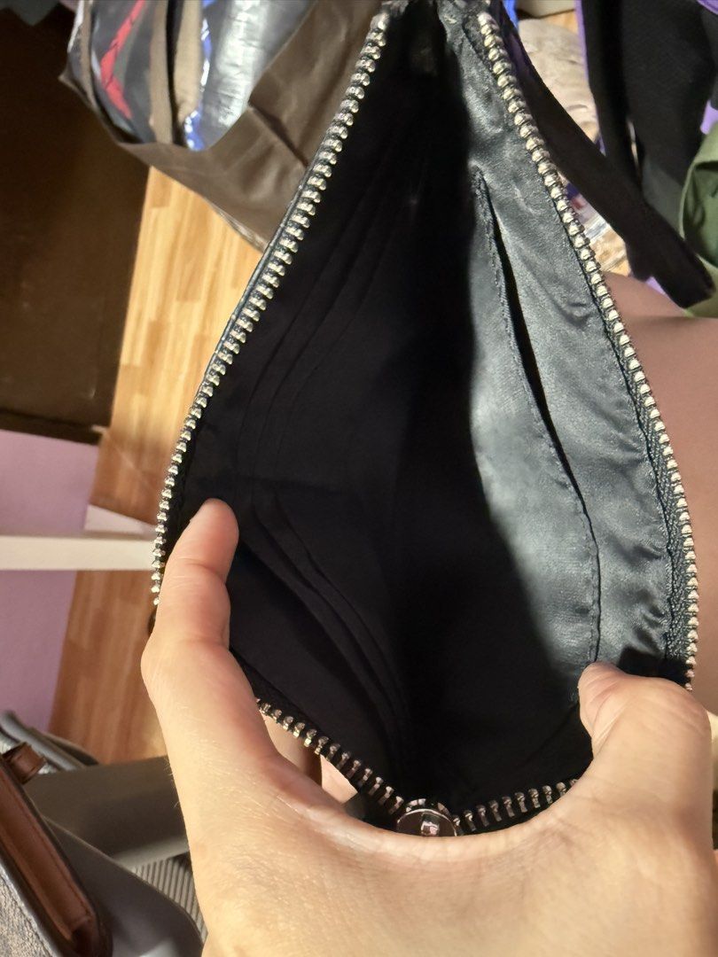 Guess Black Embossed Wristlet Clutch Wallet (Category: Wallets & Card holders) located in Antipolo. Submitted by msamericana1997 (Listing ID 1470972958, Image 3). Description: Orig Guess. Bought in the US nung 2023. Only flaw is the handle portion everything else looks good. RFS: Decluttering.