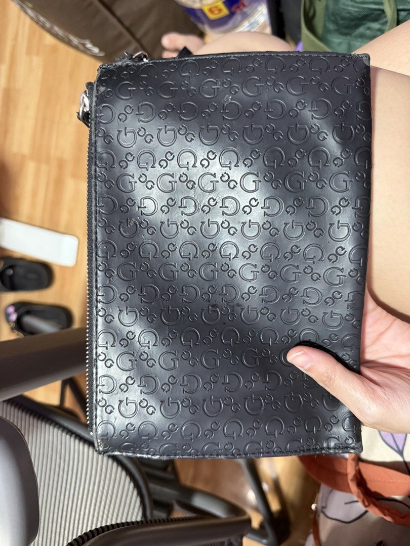 Guess Black Embossed Wristlet Clutch Wallet (Category: Wallets & Card holders) located in Antipolo. Submitted by msamericana1997 (Listing ID 1470972958, Image 2). Description: Orig Guess. Bought in the US nung 2023. Only flaw is the handle portion everything else looks good. RFS: Decluttering.
