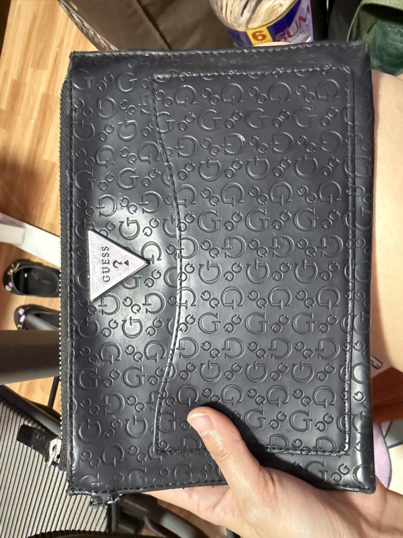 Guess Black Embossed Wristlet Clutch Wallet (Category: Wallets & Card holders) located in Antipolo. Submitted by msamericana1997 (Listing ID 1470972958, Image 1). Description: Orig Guess. Bought in the US nung 2023. Only flaw is the handle portion everything else looks good. RFS: Decluttering.