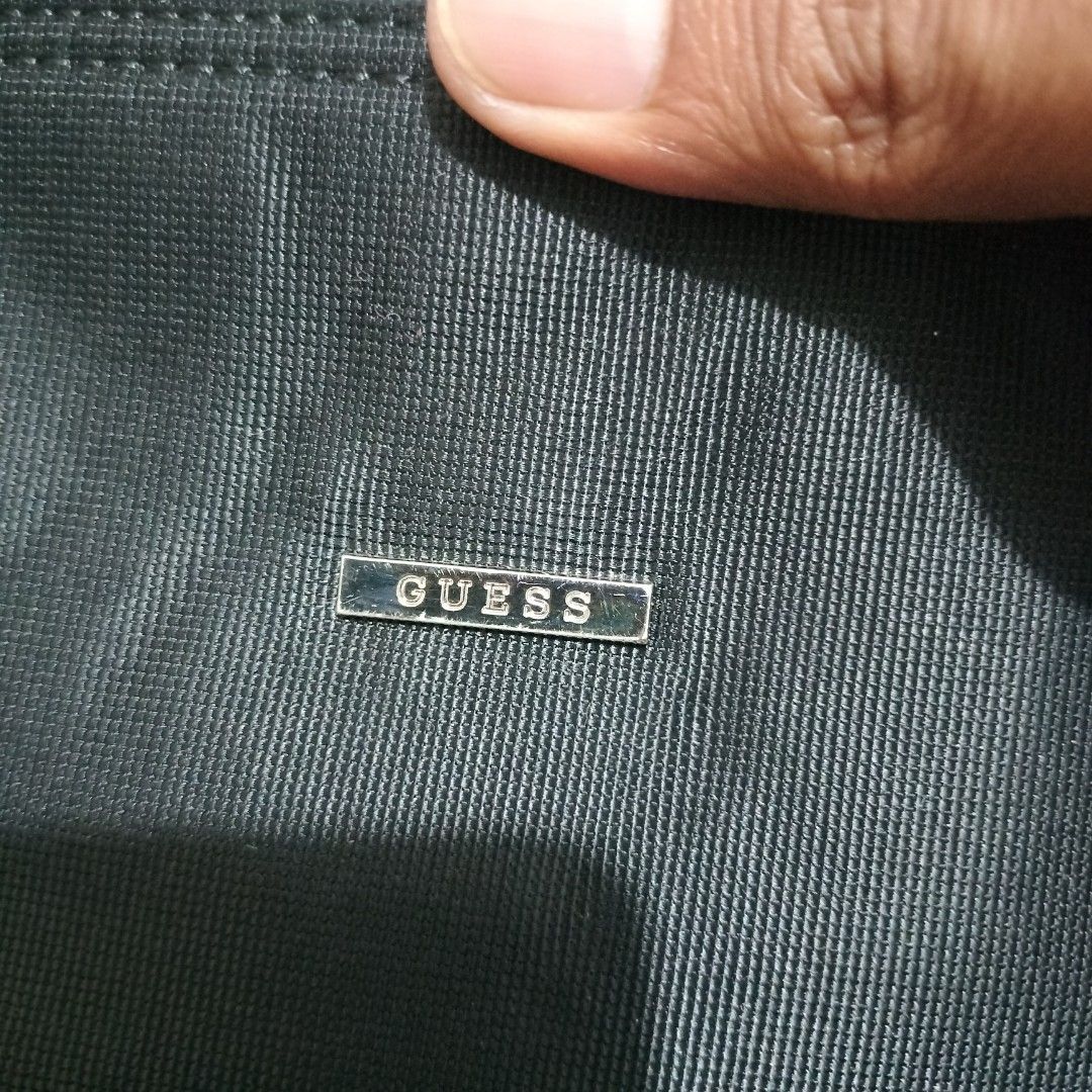 GUESS HAND BAG (Category: Tote Bags) located in Sariaya. Submitted by social_animalz (Listing ID 1471091938, Image 3). Description: 9.5 inches x 10.5 inches wood handle nylon materials YKK zip shipping fee is not included.