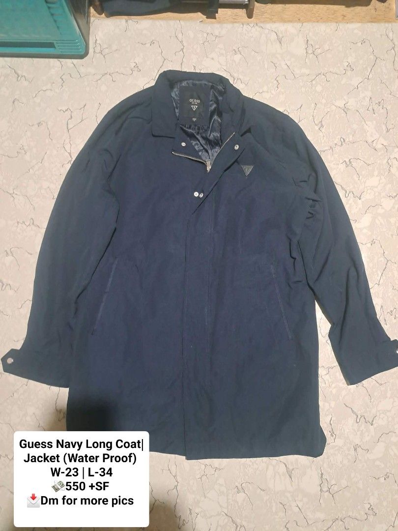 Guess Navy Long Coat Jacket Waterproof Size XL (Category: Coats, Jackets and Outerwear) located in Manila. Submitted by alexson10 (Listing ID 1471069018, Image 1). Description: - Brand: Guess - Style: Long coat / jacket - Color: Solid dark blue (navy) - Size: XL - Measurements: Width 23" | Length 34" - Material: Waterproof (great for rainy days) - Origin: Made in Vietnam - Closure: Front button and zipper - Features: Includes inner lining with a 