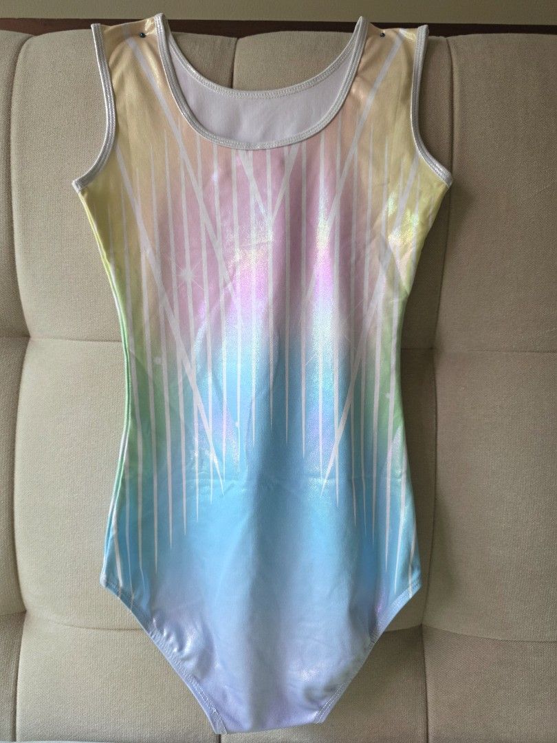 Gymnastics Leotard Pastel Gradient Size 14 (Category: Activewear) located in Pasig City. Submitted by thea_stilton (Listing ID 1470959011, Image 3). Description: - Design: Pastel rainbow gradient with sparkly rhinestones and white lining trim - Style: Sleeveless scoop neck - Size: 14 (Measures 13" across chest, 26" length) - Material: Bright, colorful, and stretchy - Condition: Ready for practice or competitions.