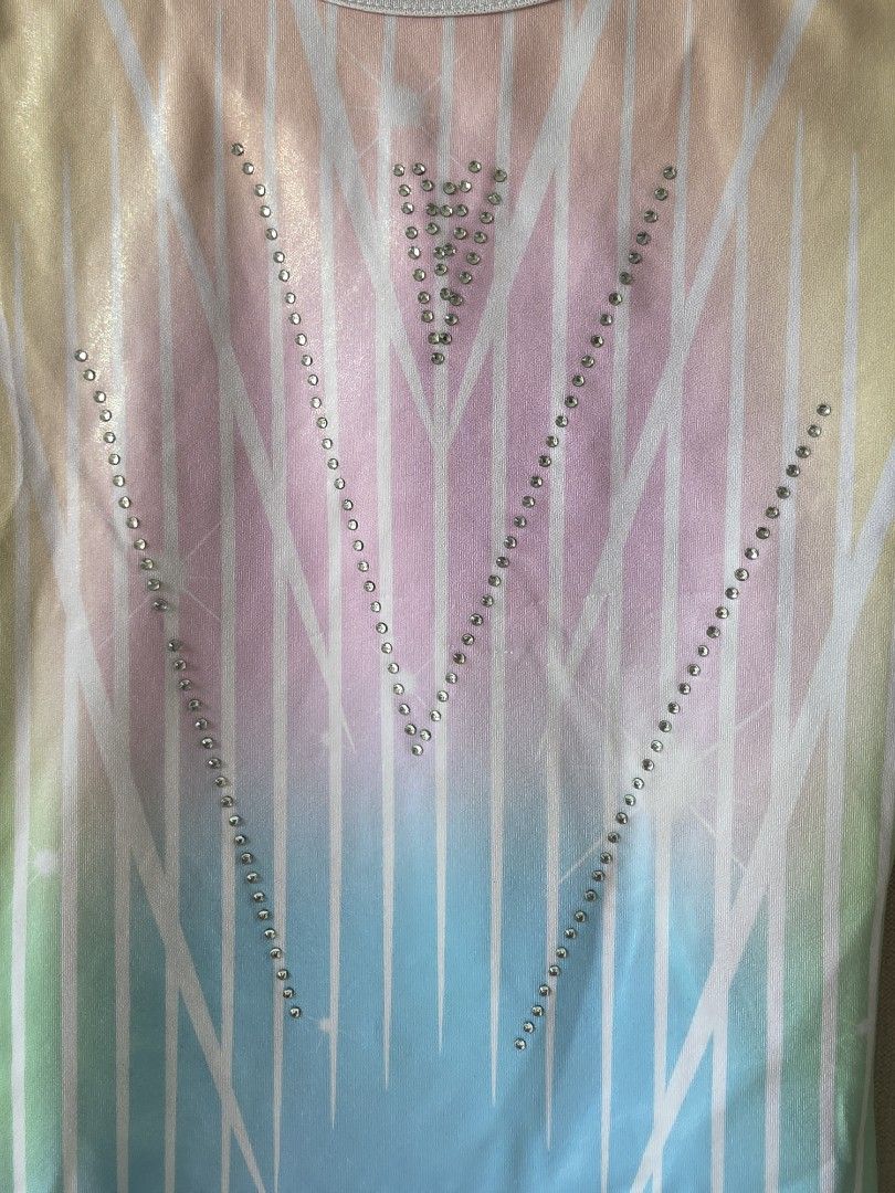 Gymnastics Leotard Pastel Gradient Size 14 (Category: Activewear) located in Pasig City. Submitted by thea_stilton (Listing ID 1470959011, Image 2). Description: - Design: Pastel rainbow gradient with sparkly rhinestones and white lining trim - Style: Sleeveless scoop neck - Size: 14 (Measures 13" across chest, 26" length) - Material: Bright, colorful, and stretchy - Condition: Ready for practice or competitions.