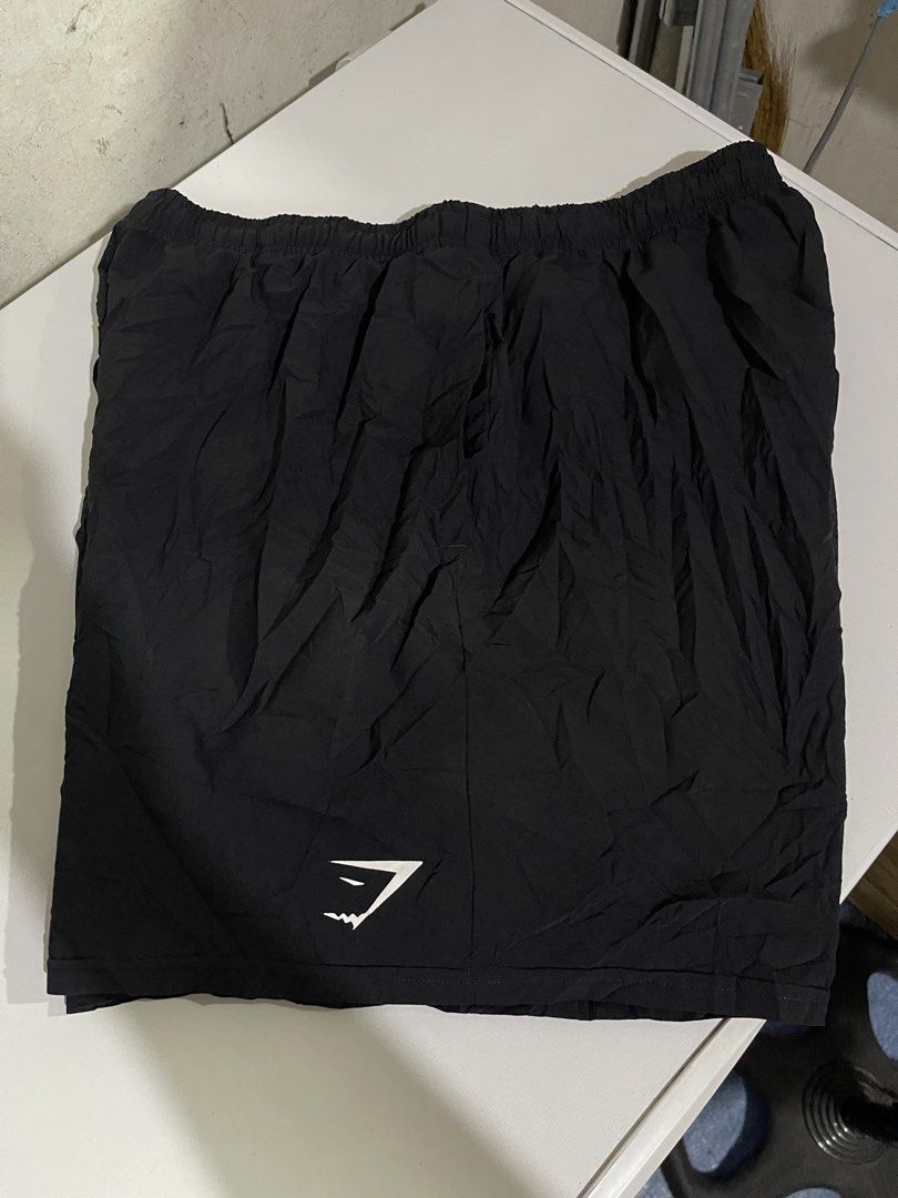 Gymshark Black Athletic Shorts Size L (Category: Shorts) located in Mandaluyong City. Submitted by mark2pac (Listing ID 1471080139, Image 1). Description: - Brand: Gymshark - Color: Classic Black - Size: Large - Condition: Brand new with tags - Features: Comfortable elastic waistband, inner mesh lining, and lightweight fabric - Details: White Gymshark logo near the bottom hem - Made in: Bangladesh - Ideal for: Workouts, gym sessions, and casual s