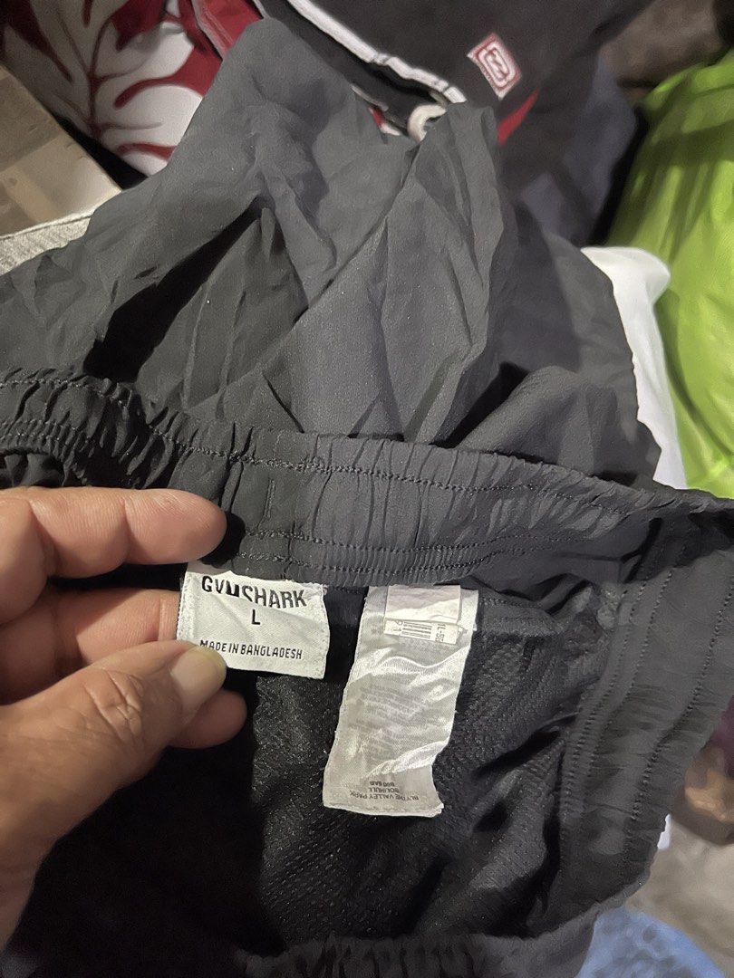 Gymshark Black Athletic Shorts Size L (Category: Shorts) located in Mandaluyong City. Submitted by mark2pac (Listing ID 1471080139, Image 2). Description: - Brand: Gymshark - Color: Classic Black - Size: Large - Condition: Brand new with tags - Features: Comfortable elastic waistband, inner mesh lining, and lightweight fabric - Details: White Gymshark logo near the bottom hem - Made in: Bangladesh - Ideal for: Workouts, gym sessions, and casual s
