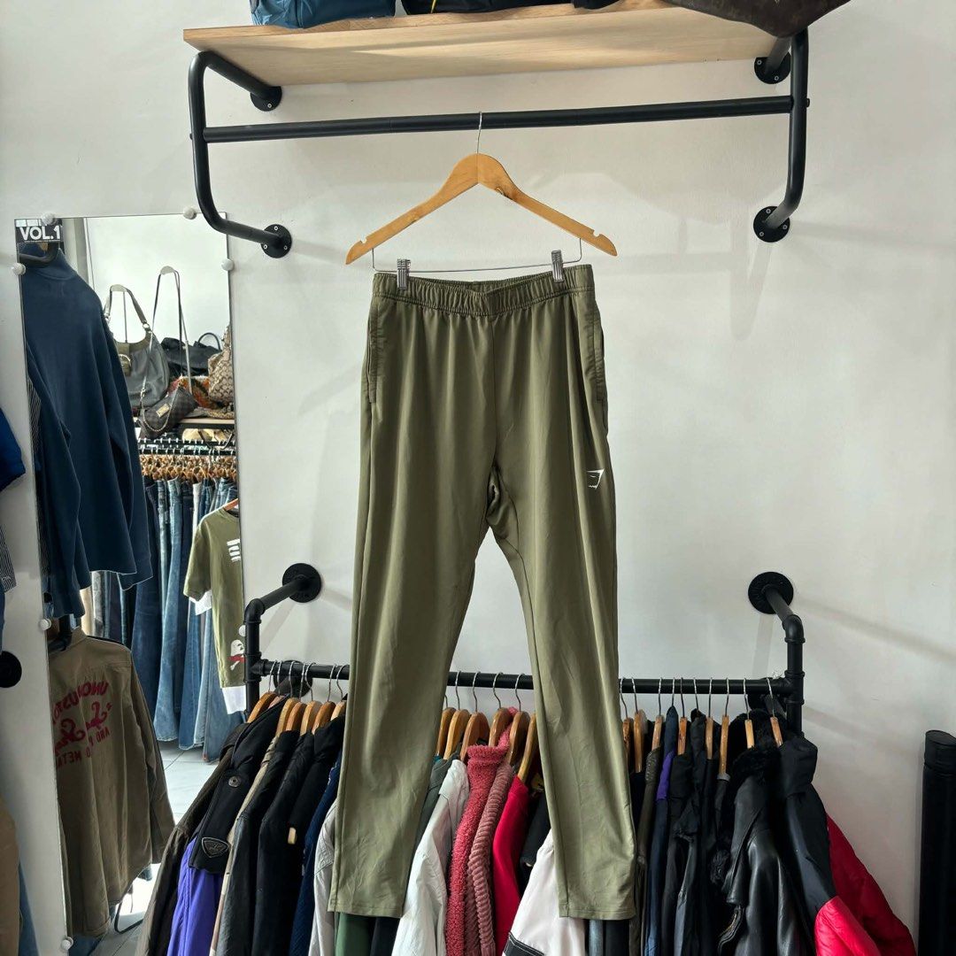 Gymshark Green Joggers (Category: Joggers) located in Bambang. Submitted by heats777 (Listing ID 1471010958, Image 2). Description: - Brand: Gymshark - Color: Green - Size: Large - Condition: Excellent - Features: Elastic waistband, side pockets, white printed logo near hem - Origin: Made in Vietnam - Ideal for: Workouts, running errands, or casual lounging.