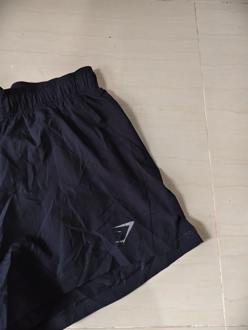 Gymshark Short (Category: Shorts) located in Iloilo. Submitted by branded-boy0422_16 (Listing ID 1470936851, Image 2). Description: W: 30-34 L: 14 Good as new Minor sign of usage lang sa logo at name.